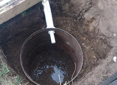 Фото: грунт и вода в выгребной яме
