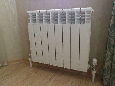 Фото: Установленный радиатор отопления